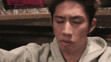 a close up of a man 's face with the letter d visible