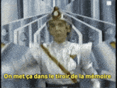a man in a silver costume says on met ca dans le tiroir de la memoire