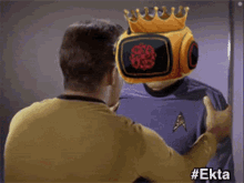 a man with a crown on his head is hugging another man with a star trek uniform