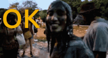 a group of people are gathered in a park with the word ok above them