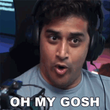 a man wearing headphones says " oh my gosh " in front of a webcam