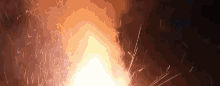 a close up of a fireworks display with sparks coming out of it