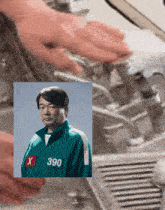 a man in a green jacket with the number 390 on his chest