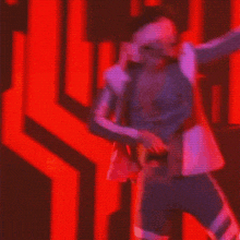 a man with blindfolds singing into a microphone