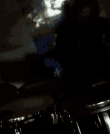 a dark room with a sign that says ' fuel ' in the background