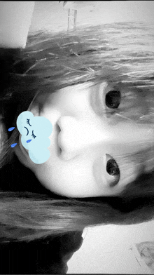 a black and white photo of a girl with a sad cloud on her face