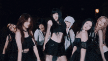 a woman with long black hair is covering her ears with her hands in a blurry photo .