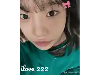a close up of a woman 's face with the words i love 222 written on the bottom