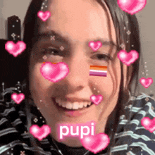 a close up of a woman 's face with hearts and the word pupi .
