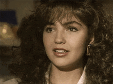 a close up of a woman 's face smiling