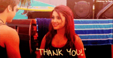 a girl with red hair is giving a man a thank you gesture