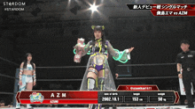 a female wrestler named azmi is standing in a ring