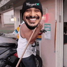 a man wearing a beanie that says blizzard on it