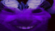 a close up of a purple face with a smile on it .