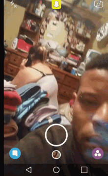 a man is taking a selfie with a snapchat filter