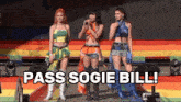 three women singing on a stage with the words pass sogie bill behind them