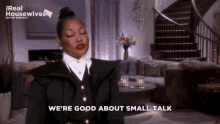 a woman says we 're good about small talk in front of a living room