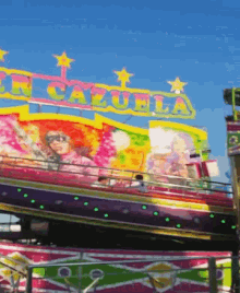 a carnival ride with the word cazuela on top