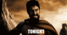 a man with a beard is holding a sword and the word tonight is on the screen