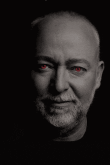 a man with a beard and red eyes has a lightning bolt coming out of his face