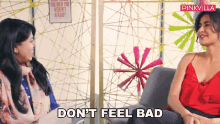 two women sitting on a couch with the words " do n't feel bad "
