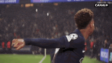 a soccer player with the number 14 on their jersey