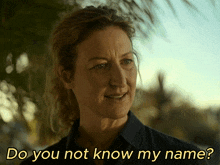 a woman says " do you not know my name " in yellow letters