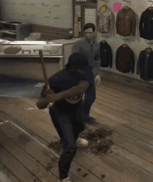 two men are fighting in a room with a sign that says lacuva on the wall