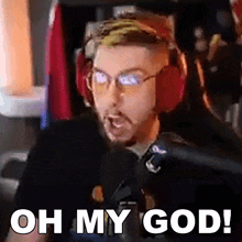 a man wearing headphones and glasses says oh my god
