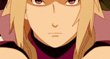 a close up of a cartoon character 's face with blonde hair and purple eyes .