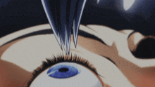 a close up of a person 's eye with a fork sticking into it
