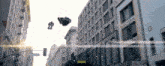 a busy city street with a yellow sign that says nyc taxi on it