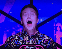 a man with his mouth open and a sign that says regret on it