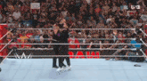 two wrestlers in a wrestling ring with the word usa on the bottom