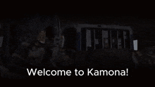 a screen says welcome to kamona with a man laying on the ground