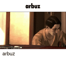 a man is looking at himself in a mirror and the word arbuz is above him