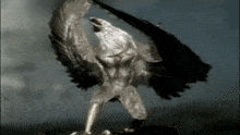 a statue of a man with wings is being attacked by an eagle