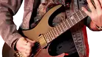 a man is playing a guitar with the letter r on it