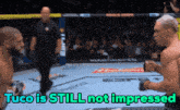 two men in a boxing ring with the words tuco is still not impressed above them