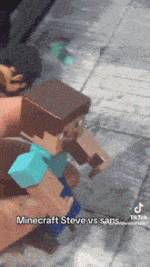 a person is holding two minecraft steve figures