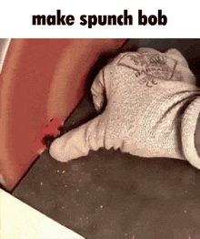 a person wearing a glove is making a punch in a piece of metal .