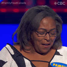 a woman with glasses and a name tag that says pamela