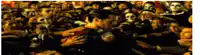 a crowd of people are gathered around a man in a crowd