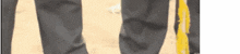 a close up of a person 's legs with a yellow stripe on the bottom .
