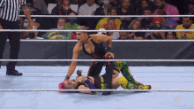 a woman in a wrestling ring is wearing a shirt that says munchie
