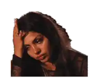 a woman with a nose ring is holding her head