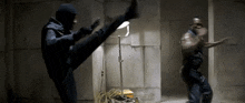 a man in a mask is kicking another man in the face .