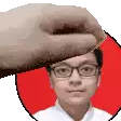 a hand is holding a man 's head in a red heart .