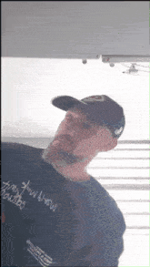 a man with a beard wearing a hat and a shirt that says " i 'm with you " on it