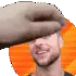 a man with a beard is smiling while a hand holds his head .